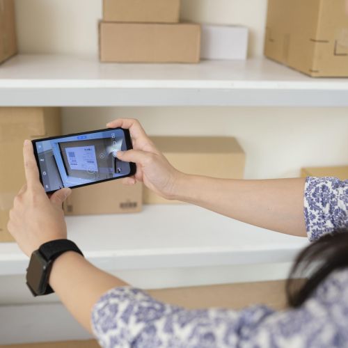 young-woman-taking-pictures-delivery-boxes